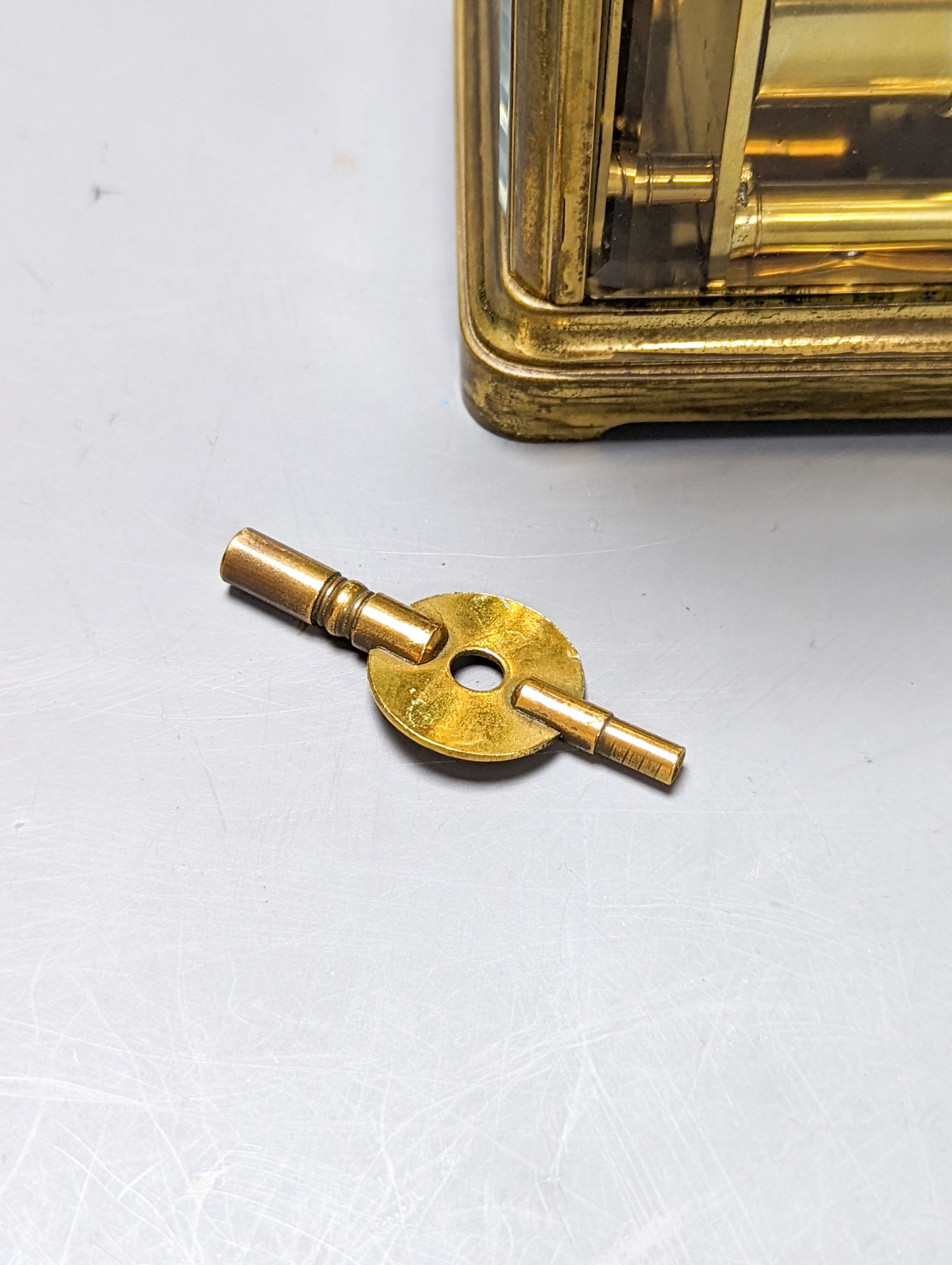 A French brass repeating carriage clock with key. 13.5cm